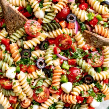 A vibrant bowl of Italian Pasta Salad with fresh vegetables and dressing