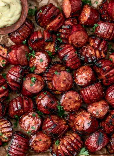 Mustard Hasselback Kielbasa Bites served on a platter