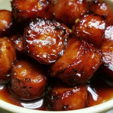 Sweet Crock Pot Kielbasa Bites appetizer served in a bowl