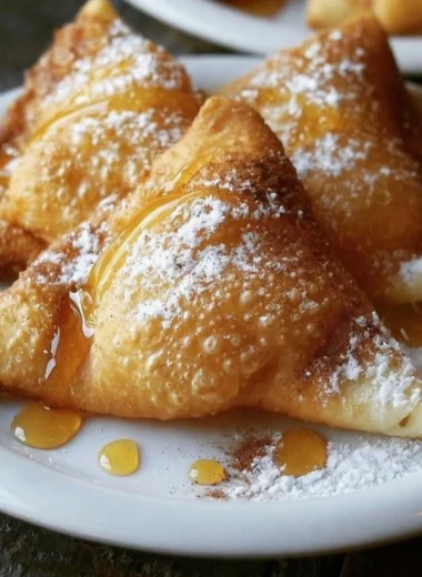 Golden, fluffy sopaipillas served warm, perfect for dipping in honey.