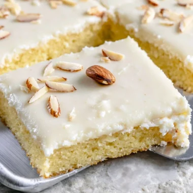 Delicious White Texas Almond Sheet Cake with almond frosting and toppings