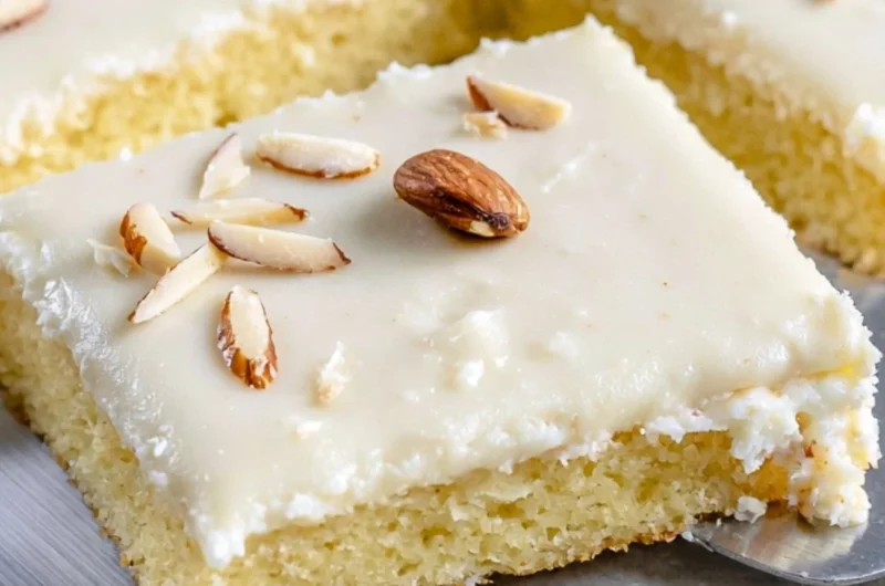 Delicious White Texas Almond Sheet Cake with almond frosting and toppings