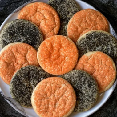 Festively decorated Halloween sugar cookies in various spooky shapes.