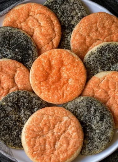 Festively decorated Halloween sugar cookies in various spooky shapes.