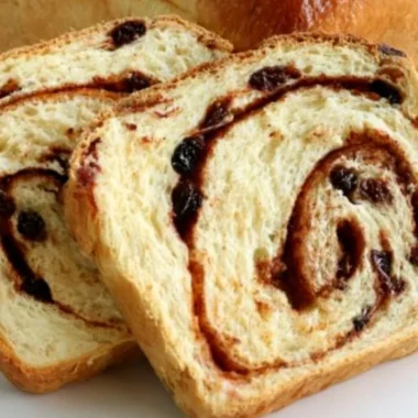 Homemade cinnamon swirl raisin bread fresh out of the oven